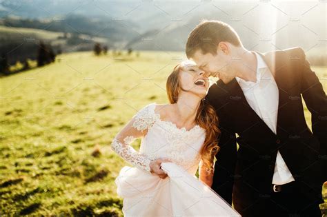 Happy wedding couple smiling | People Images ~ Creative Market