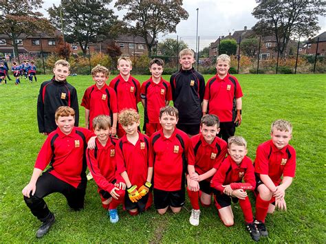 Group photo of the 2021 Year 7 boys football team, on the fields at ...