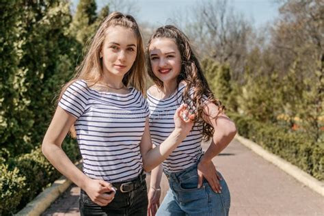 Two Smiling Young Female Girl Friends Having Fun in Park. Two Teen ...