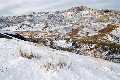 Badlands In Snow Photograph by Larry Ricker