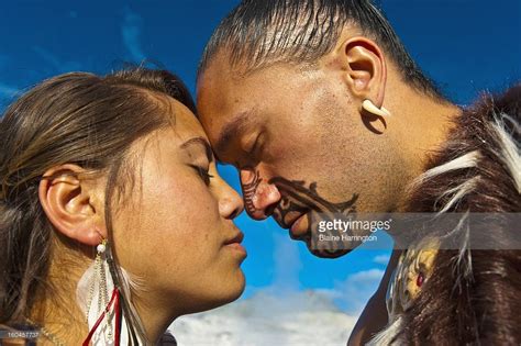 Customs: This image is of two people doing the greeting Hongi, and the ...