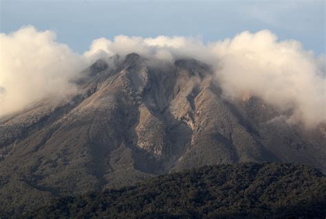 Philippines raises alert level at restive volcano after spewing cloud ...