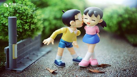 Download Nobita Shizuka Love Story On Pavement Wallpaper | Wallpapers.com