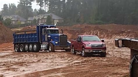 my ford f150 in the mud pulling out a stuck dump truck - YouTube