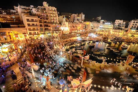 As the sun sets St Julian, Malta, lights up to an array of restaurants ...