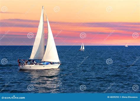 Sailboats at sunset stock photo. Image of orange, boats - 4839292