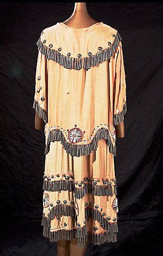 Pictured is the back of the Anishinaabe Indian dress on display at the ...