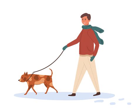 A young man walks with a dog on a leash in winter time. Happy owner and ...