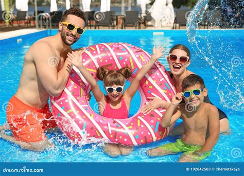 Family Fun In Swimming Pool - Mother, Father, Baby Dive Underwater ...