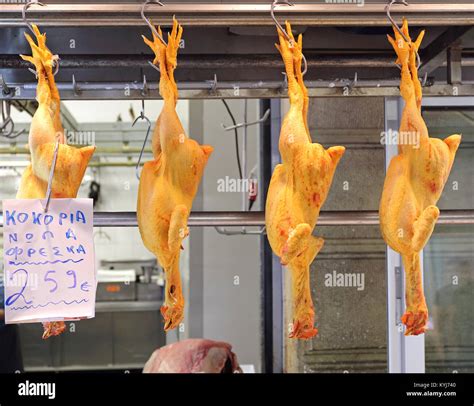 Roosters Poultry Hanging at Butcher Shop in Market Stock Photo - Alamy