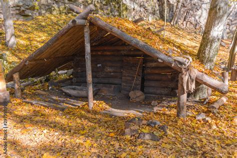 Dugout (or dug-out, pit-house, earth lodge, cellar dug) from logs in ...