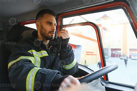 Firefighter using radio set while driving fire truck 38350980 Stock ...