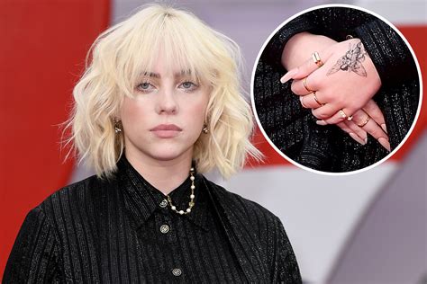 Billie Eilish debuts fairy hand tattoo at James Bond premiere