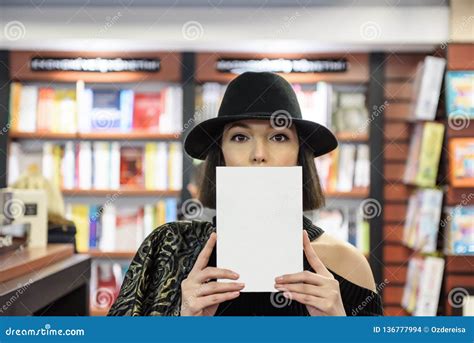 Beautiful Woman Covers Her Face with a Book Stock Photo - Image of hide ...