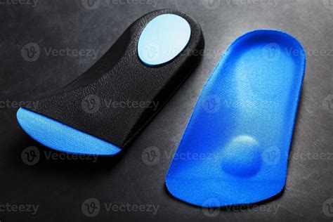 Orthopedic insoles for correction of pronation of the foot on a dark ...