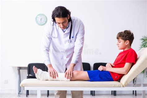 Leg Injured Boy Visiting Young Doctor Traumatologist Stock Image ...