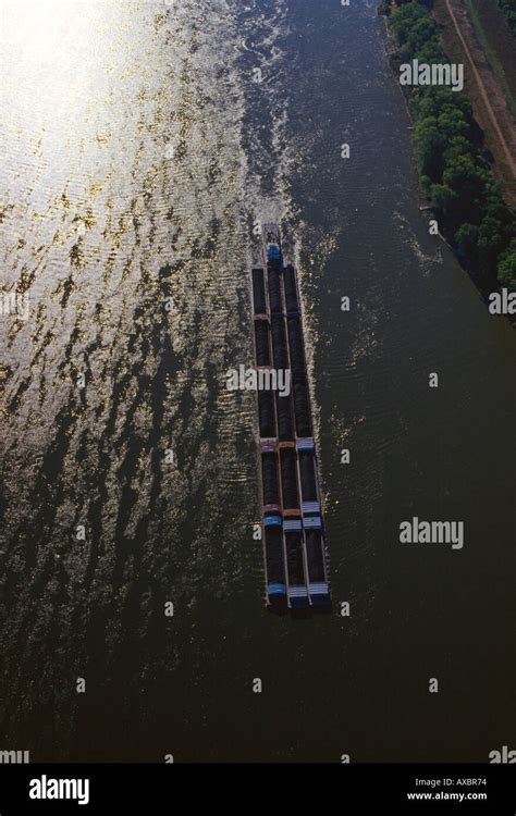 Aerial view of coal barge traveling up Mississippi River near Hannibal ...