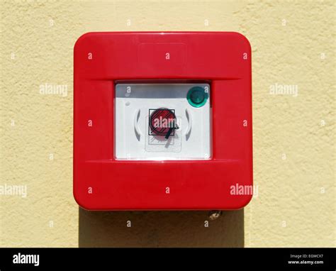 red fire alarm box on the wall Stock Photo - Alamy