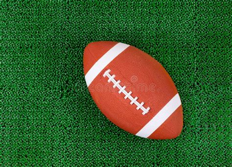 American Football on Artificial Green Grass Turf Field Stock Photo ...