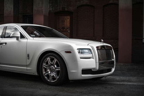 Photo of White Rolls-Royce Ghost Parked Near Brown Building · Free ...