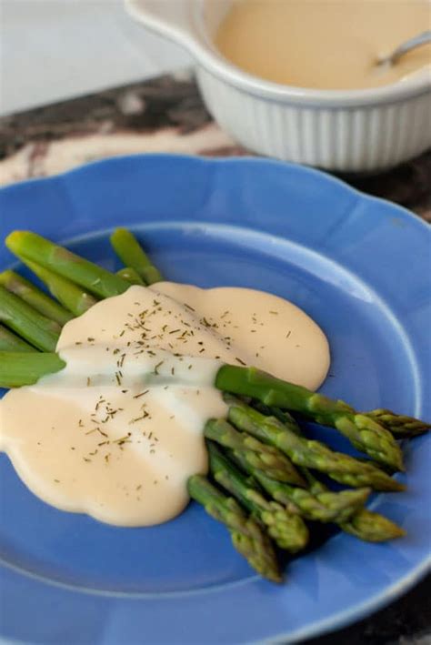 Asparagus smothered in Easy Cheese Sauce on a large blue plate. | Basic ...