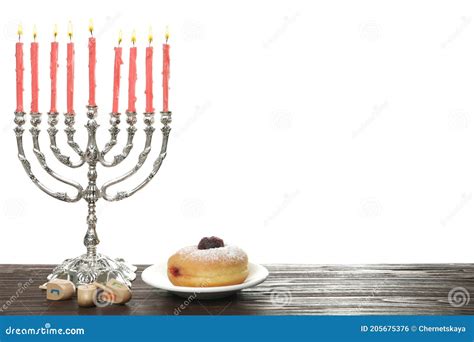 Silver Menorah Near Sufganiyah and Dreidels with Symbols Nun, he, Pe ...