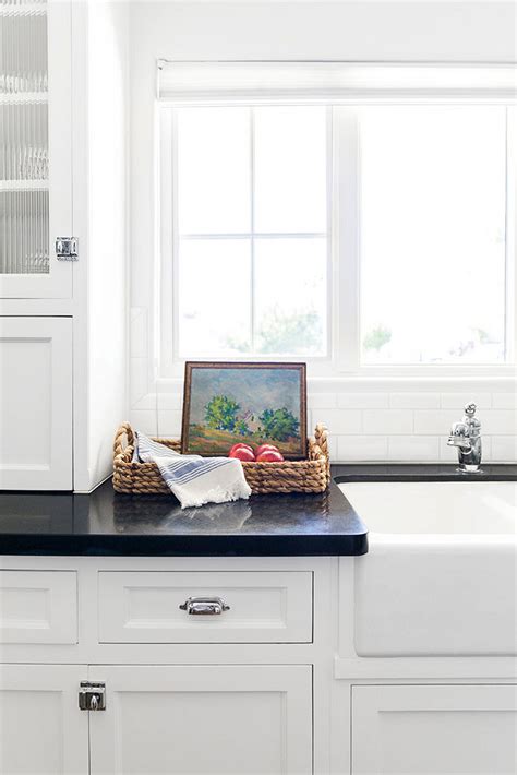 White Kitchen Cabinets with Black Countertops Are the Next Big Reno Trend