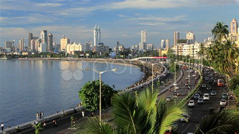 Mumbai City skyline across the water from Marine Drive, Mumbai, India ...