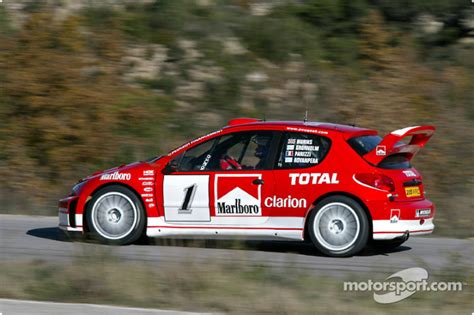 Gilles Panizzi in the new Peugeot 206 WRC 2003 at Peugeot 206 WRC 2003 ...