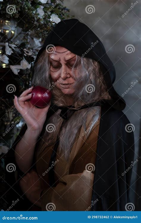 Stepmother Witch Gives Poisoned Red Apple.Woman As Witch in Black ...