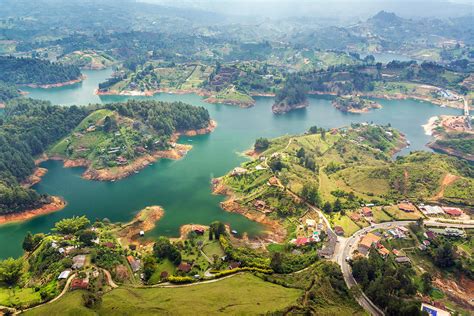 Guatape Lake Photograph by Jess Kraft - Fine Art America