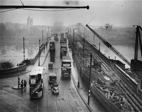 Putney bridge over the Thames shows the heavy traffic which made ...