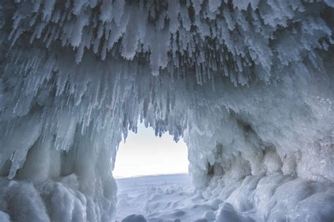 Explore stunning frozen ice caves and waterfalls during a Pictured ...