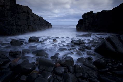 Black rocks one sea shore under white clouds HD wallpaper | Wallpaper Flare