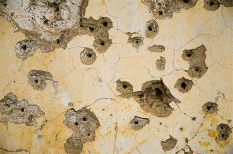 Wall With Bullet Holes Stock Photo - Download Image Now - iStock