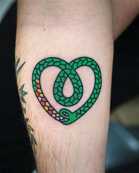 Heart-shaped green snake by @woo_loves_you - Tattoogrid.net