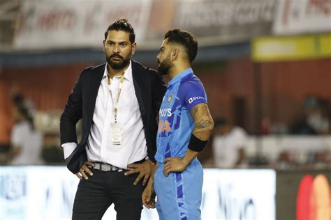 Yuvraj Singh and Virat Kohli have a chat before the start of the match ...