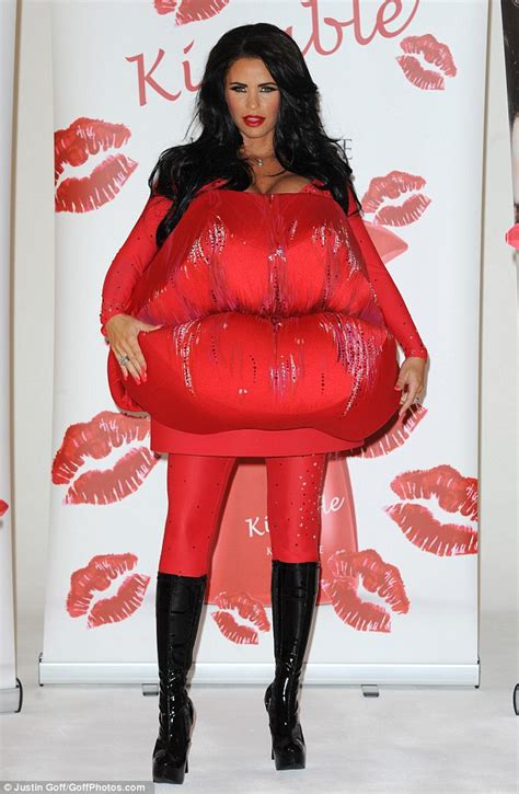 Katie Price hides her pregnancy figure under huge lips costume in yet ...