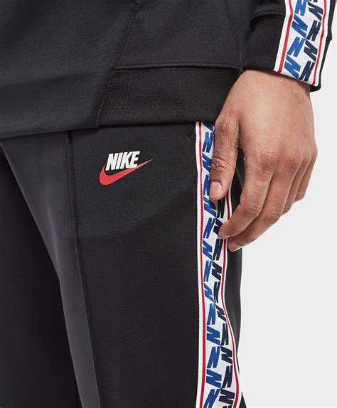 Nike Synthetic Taped Poly Track Pants in Black for Men - Lyst