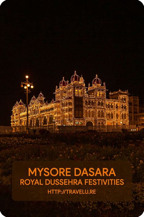 a large building lit up at night with the words mysore daasaa royal ...