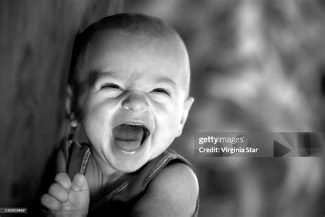 Happy Baby Laughing High-Res Stock Photo - Getty Images