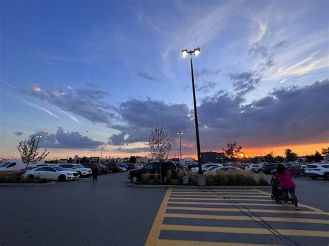 Grocery store parking lot with a sunset straight out of a painting : r/pics