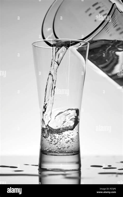 A studio photo of a tall water glass Stock Photo - Alamy