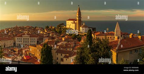 Piran town at sunset Stock Photo - Alamy