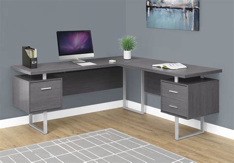 a computer desk with two drawers and a monitor