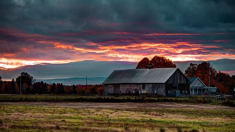 Download Farmhouse In An Empty Field Wallpaper | Wallpapers.com