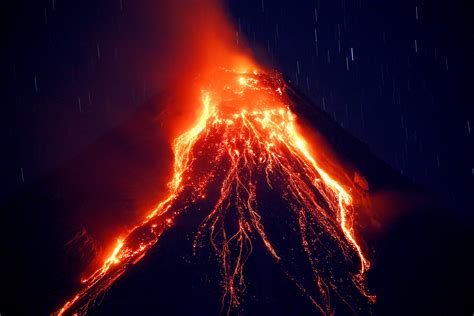 Philippine volcano spews lava fountains, 56,000 people flee