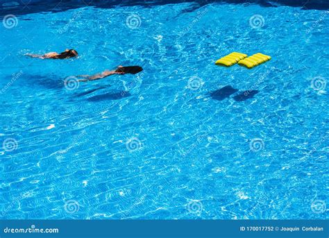 Girls Playing with a Float in the Pool Stock Photo - Image of play ...