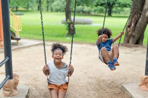 Premium Photo | Happy African American little girl and boy have fun at ...