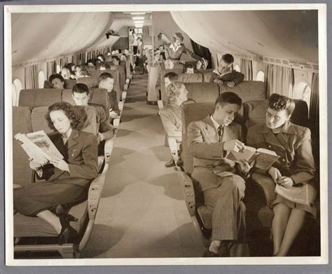 an old black and white photo of people sitting in seats on the air ...